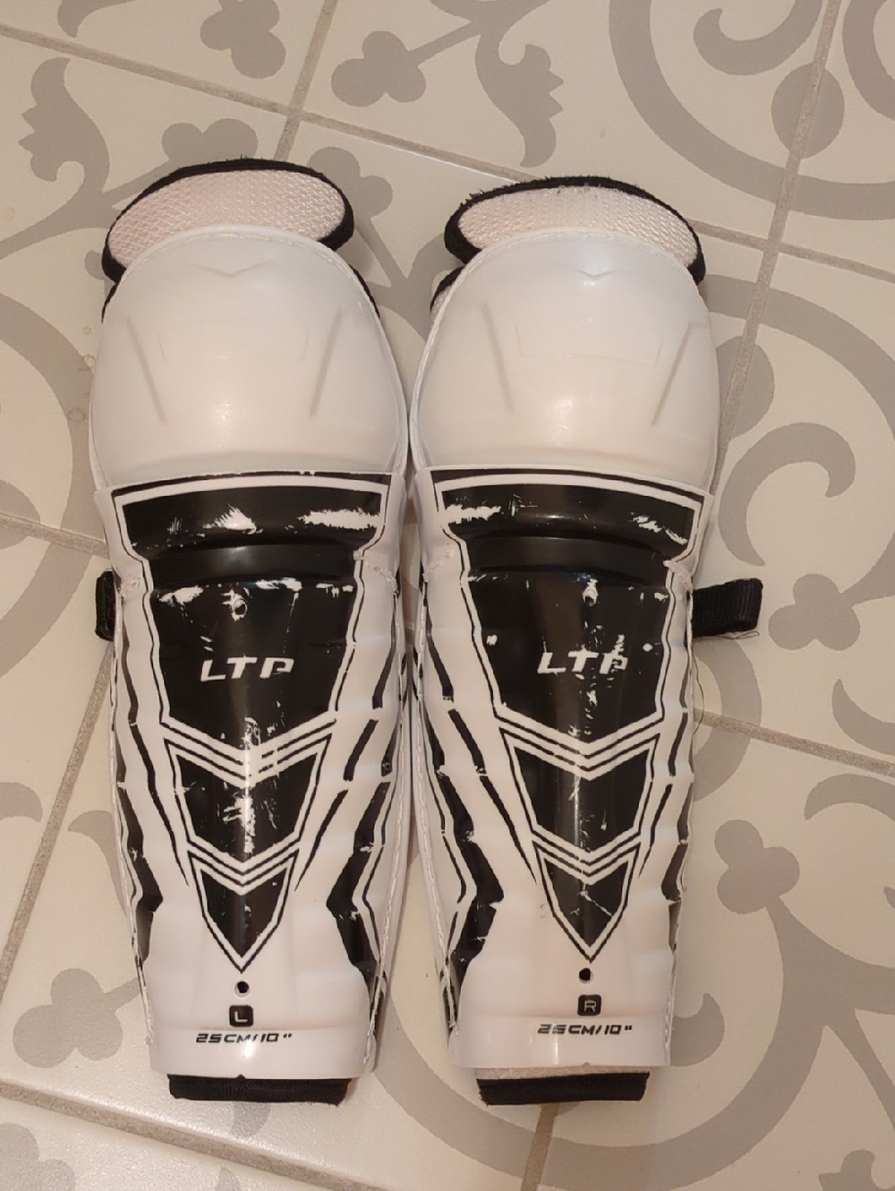 CCM LTP Youth Ice Hockey Shin Guards in White and Black